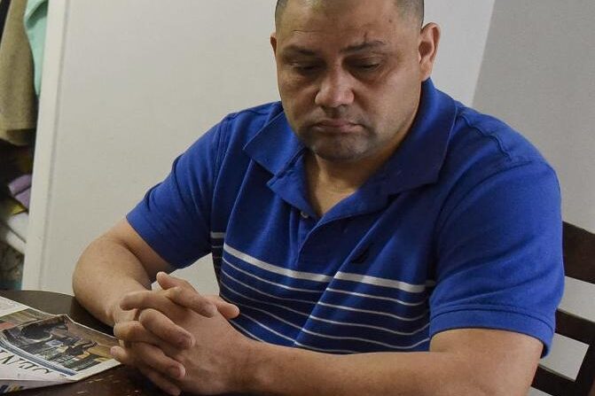 Eleazar Lopez Ayala sits at the kitchen table in his Manchester home last month.